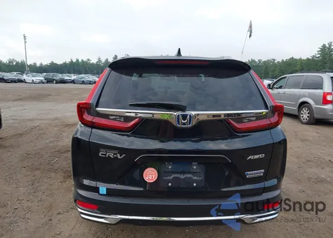 2021 Honda Cr-V Hybrid Touring z USA, uszkodzony, nr VIN 7FART6H96ME001993